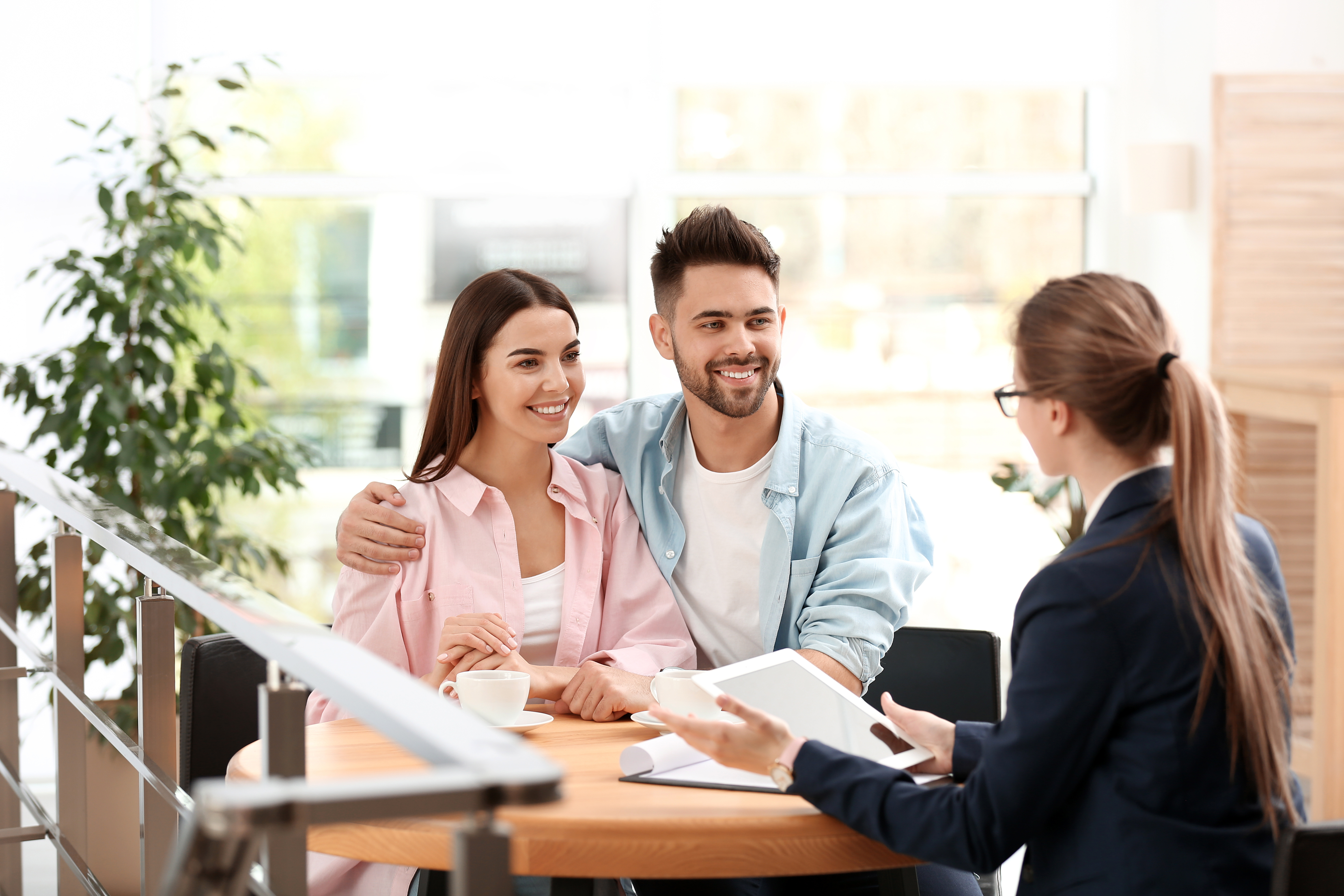female insurance agent meeting with couple